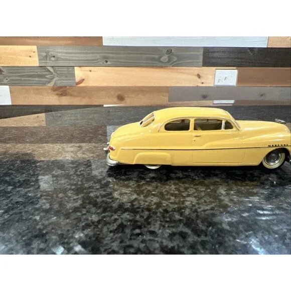 1:43 EMPIRE ZAUGG MODEL TIN WIZARD 6 MERCURY 51 1951 YELLOW